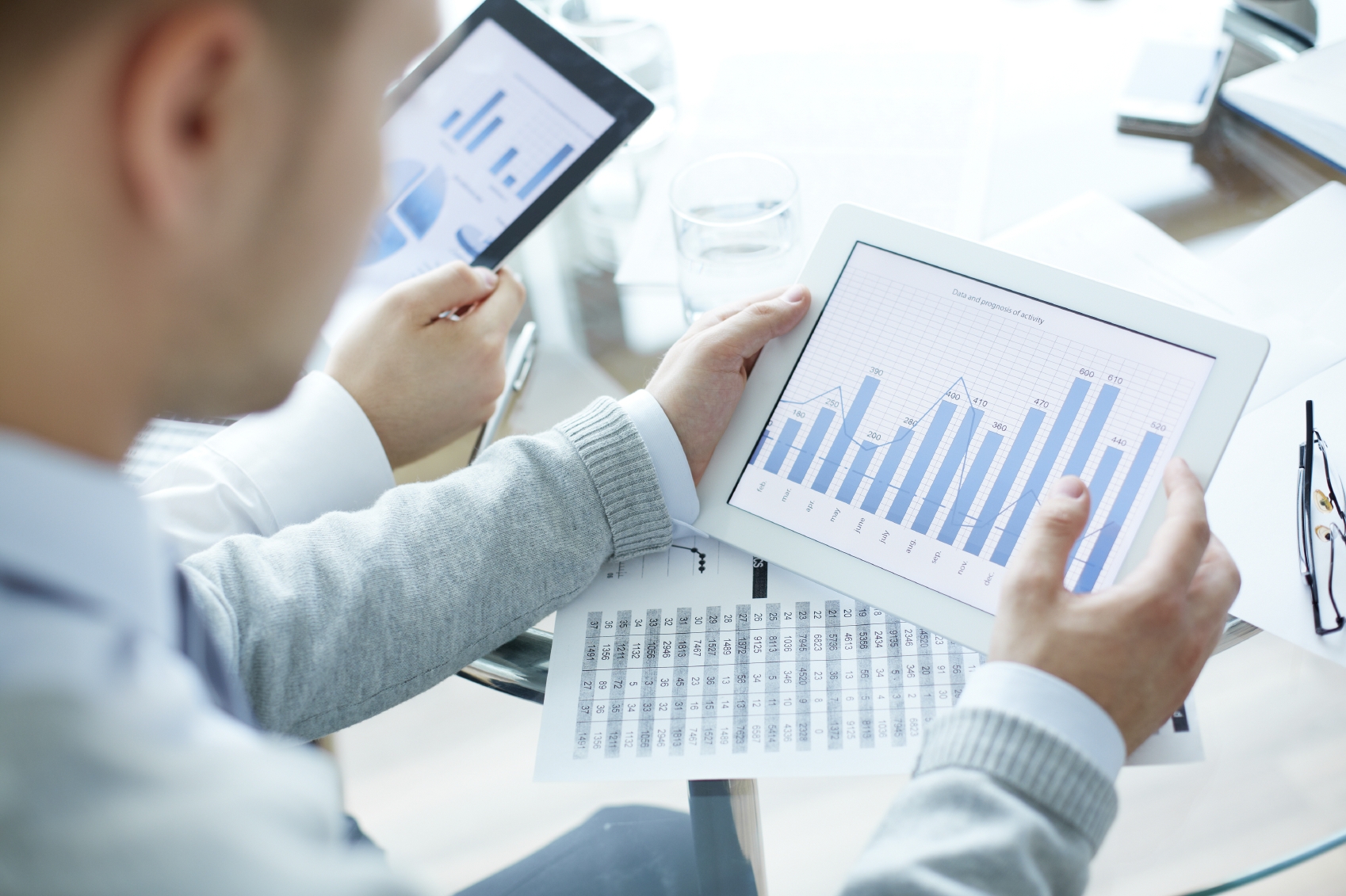 Close-up of business people working with touchpads